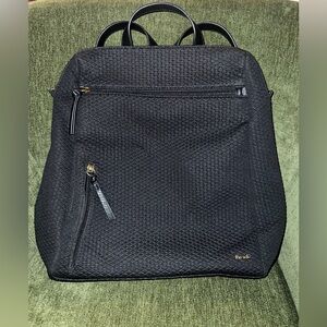 Black neoprene laptop backpack from the Sak